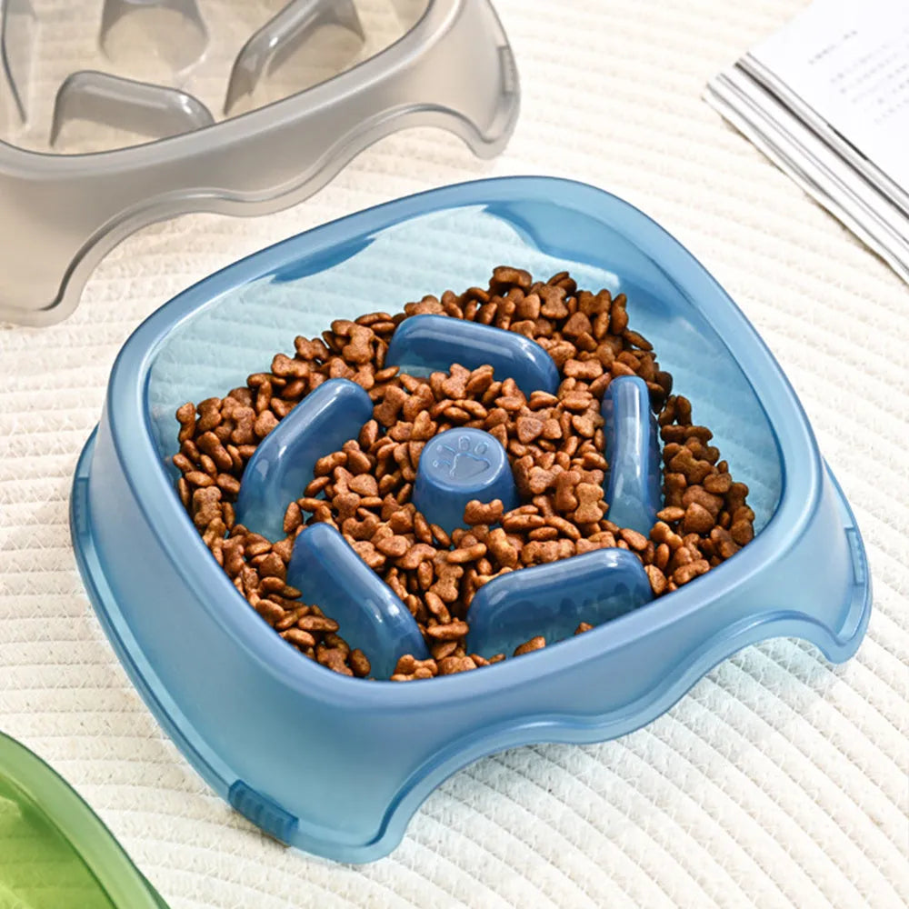 Blue plastic dog slow feeder anti-choking bowl on a white background.