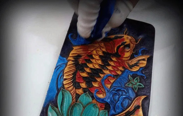 Men's solid colour leather short wallet with manual carving detail, shown in blue, red, and gold.