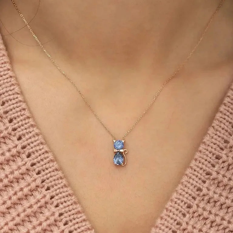 Sweet fashion necklace with titanium steel kitty pendant and coloured zircon stones on copper water wave chain.