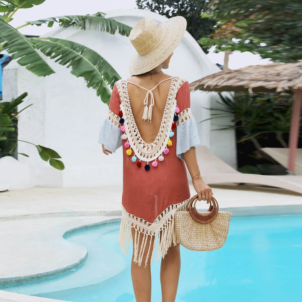 Orange floral beach overskirt with hand crochet detail and tassels, shown with a matching blouse.