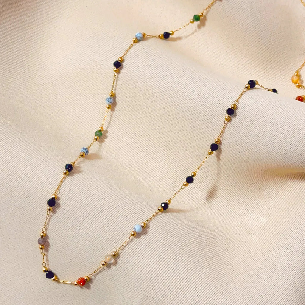 Gold titanium steel women's necklace with natural stone pendant on O-ring chain.