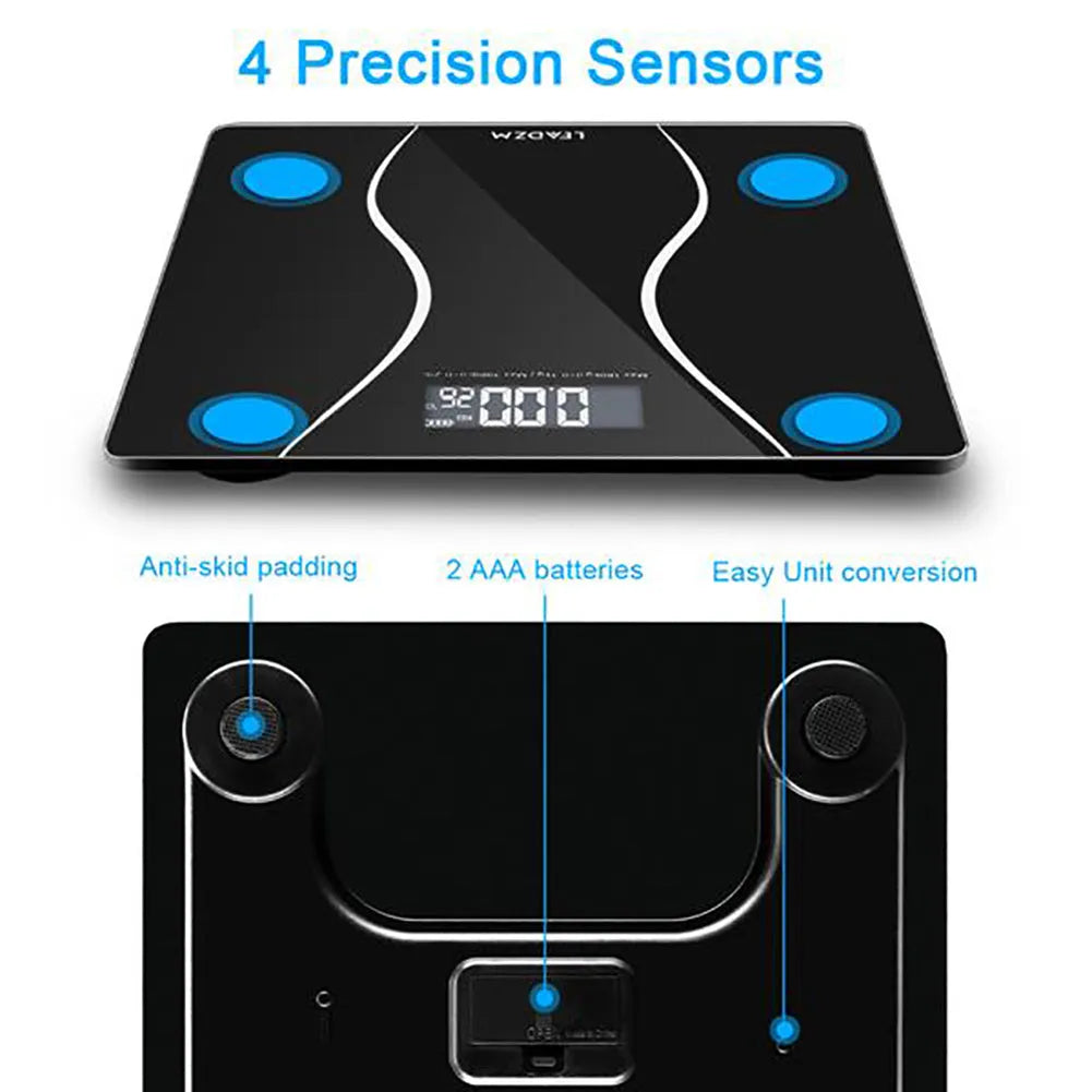 Black electronic digital body scale on a floor, showing a weight reading.