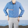 Hong Kong style loose-fit cotton blend cardigan shirt in light blue, showing non-ironing casual design.