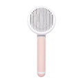 Pumpkin-coloured hand-held pet brush with curved stainless steel teeth for grooming cats and dogs