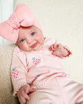 Infant wearing a light blue polyester 3-piece set with long sleeves, pants, and a matching hat.