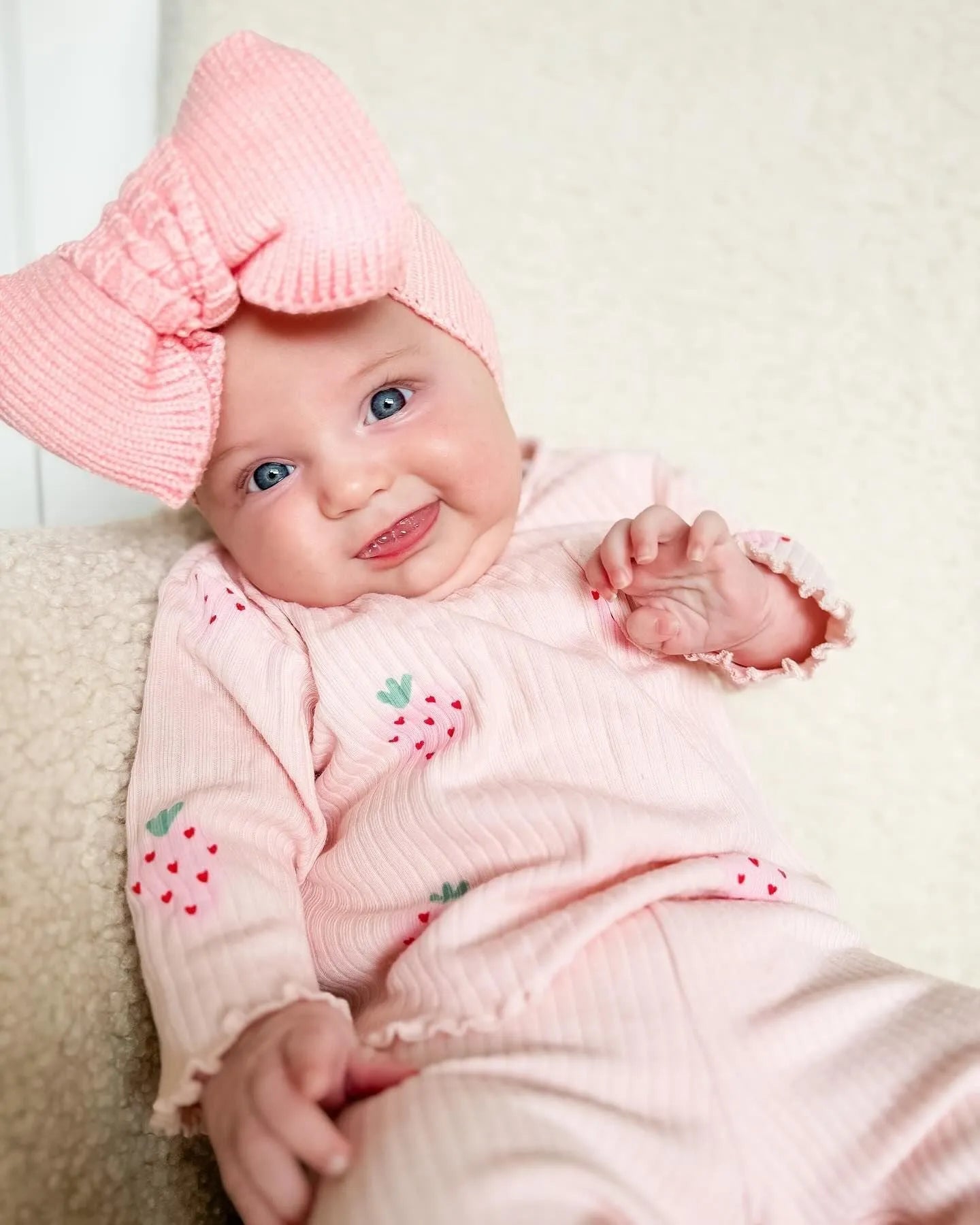 Infant wearing a light blue polyester 3-piece set with long sleeves, pants, and a matching hat.