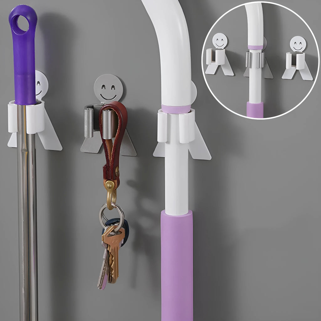White bathroom toilet mop hook with adhesive backing for wall mounting, holding a toilet brush handle