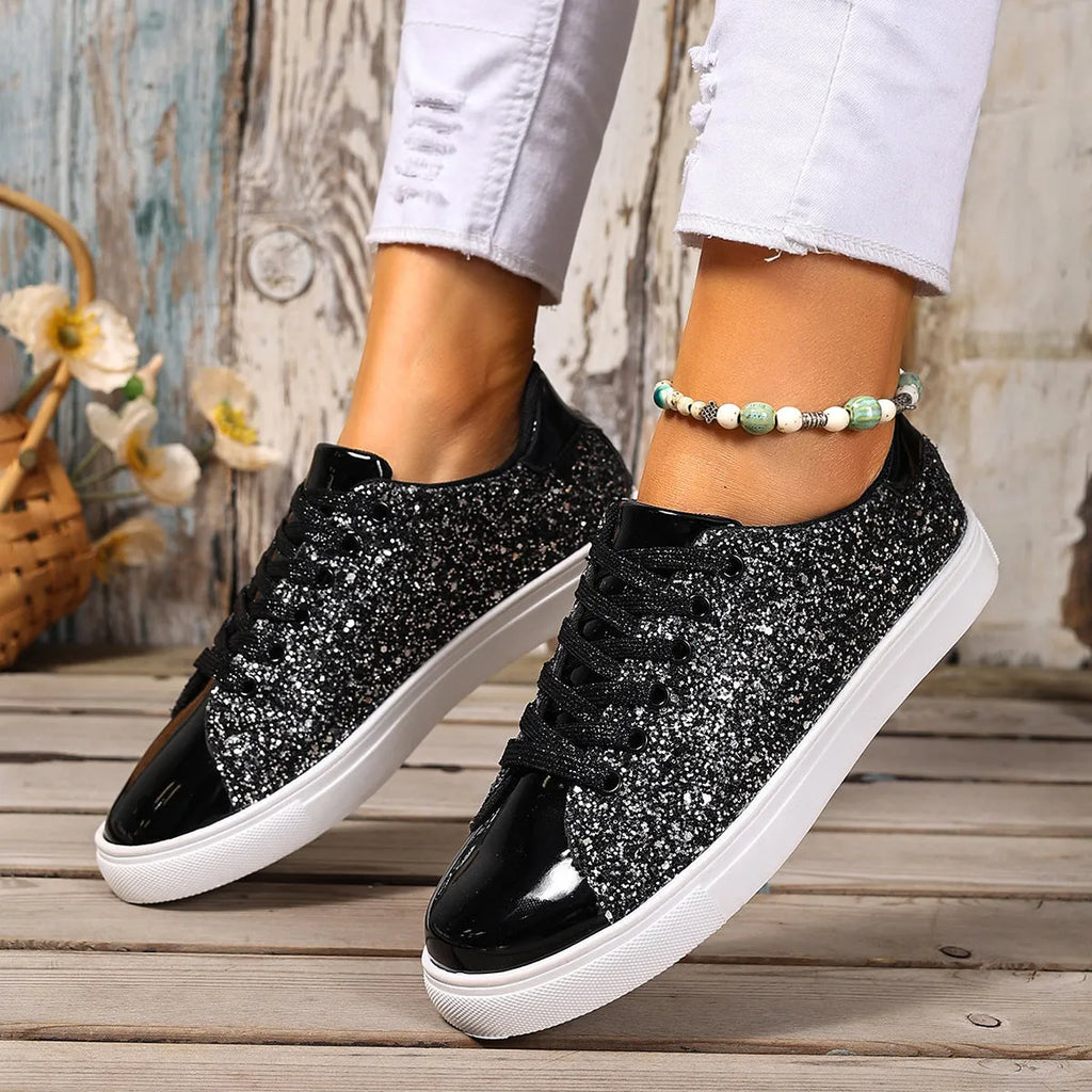 Women's plus size sequinned board shoes in black with front lace-up detail.