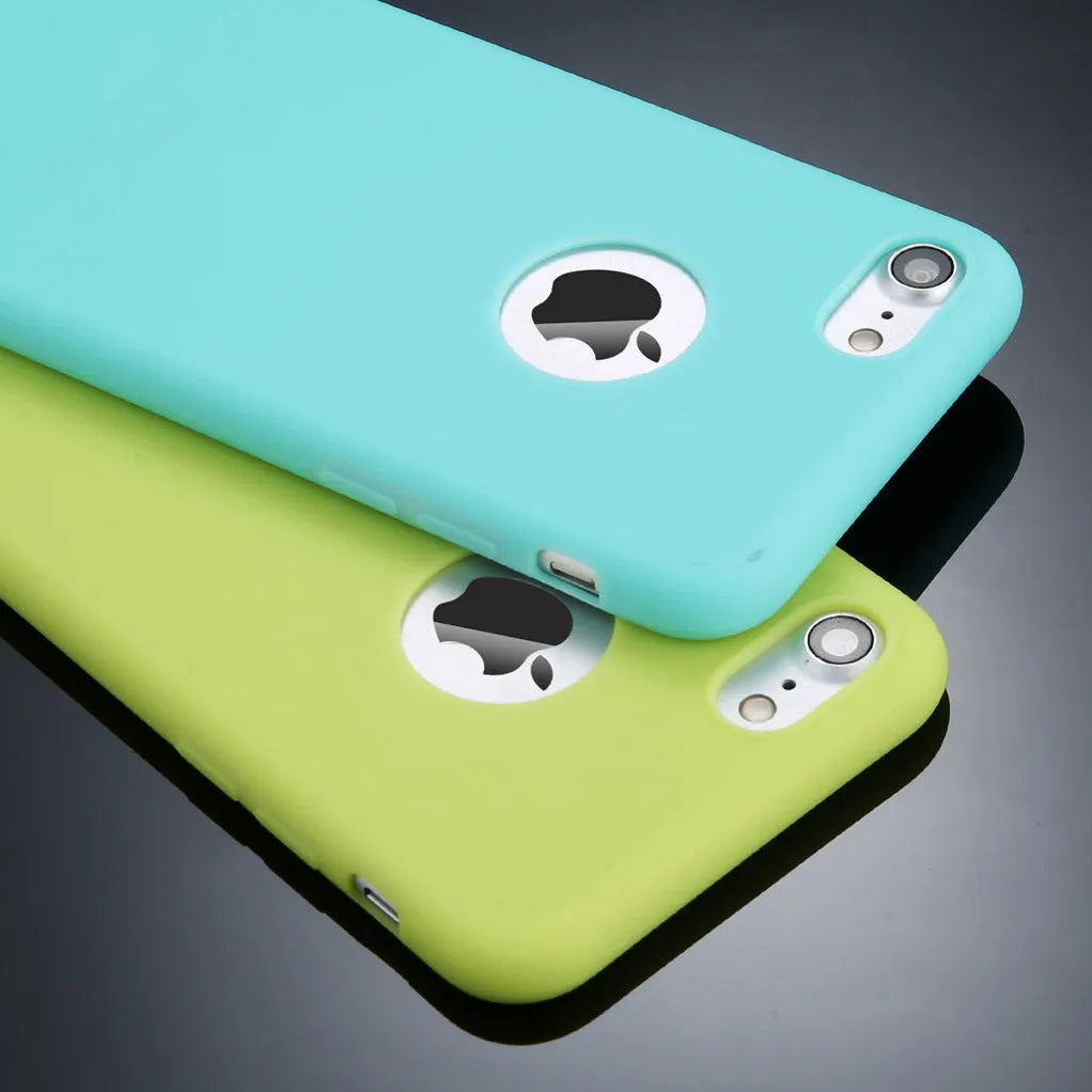 Soft silicone TPU iPhone case in candy colours including pink, blue and red on a plain background