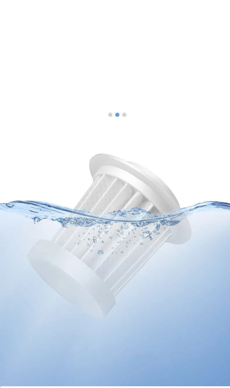 White car mini vacuum cleaner with brush nozzle and long flat nozzle on car seat