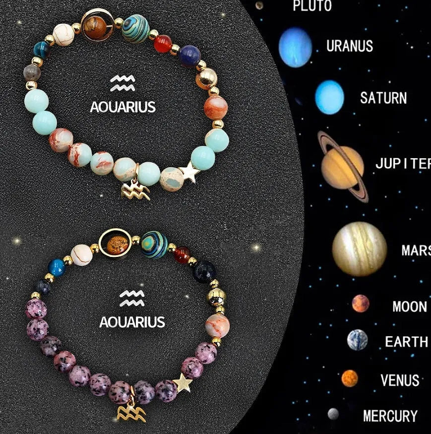 Close-up of two natural stone beaded bracelets with adjustable knots on a wooden surface, showing zodiac charm details.