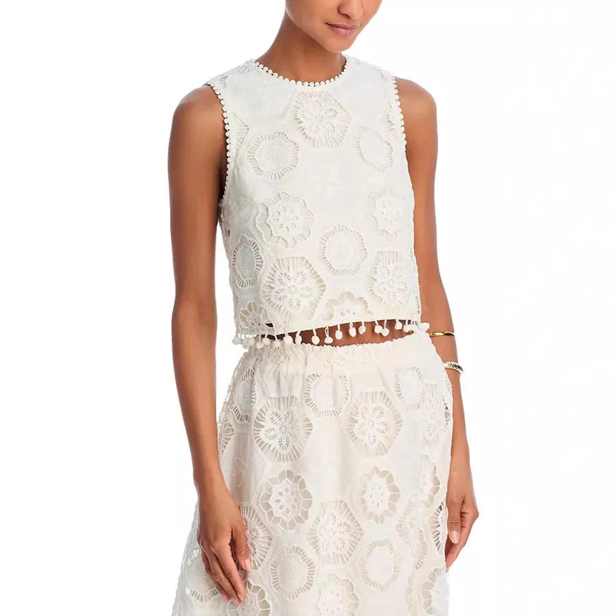 Women's white embroidered sleeveless suit with matching long skirt, retro two-piece set on a hanger