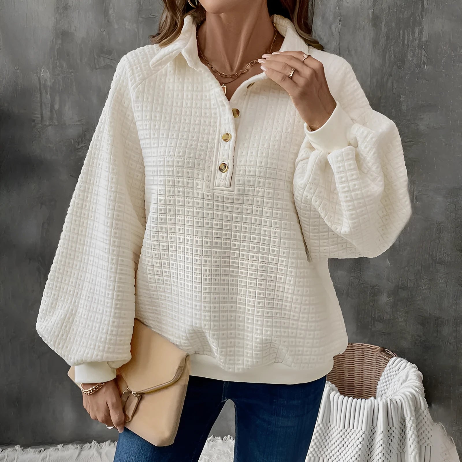 Women's milky white thick knit sweater with a polo collar.