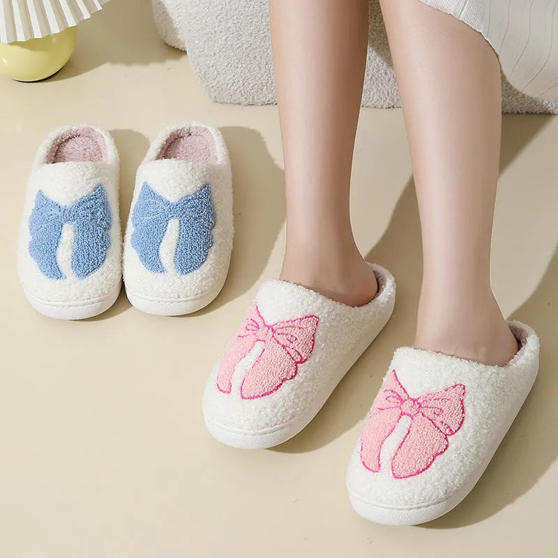 Pink and blue cartoon bow knot oversleeve slippers with suede upper and TPR sole.