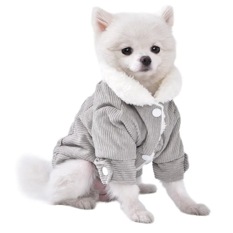 A grey lambswool-lined padded vest for dogs, shown on a mannequin, for winter warmth.