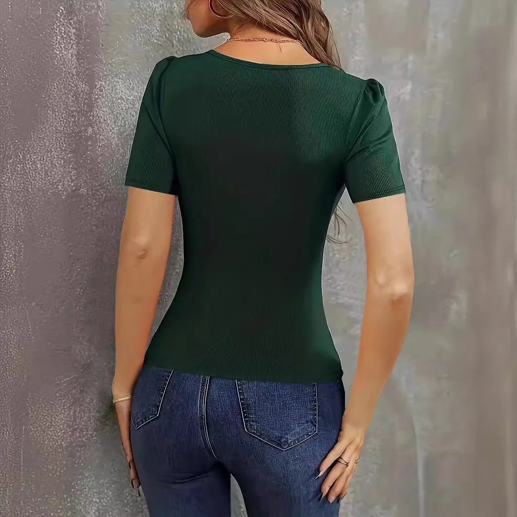 Women's wine red polyester knitted pullover with slim fit and low neckline on a hanger.