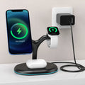 Black three-in-one magnetic wireless charging station for iPhone, Apple Watch, and AirPods on a wooden surface.