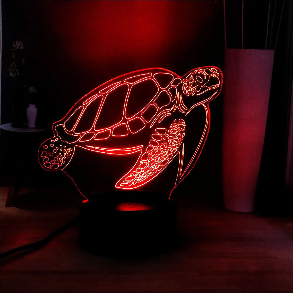 3D sculpted green turtle LED night light glowing with multi-colours on a dark surface