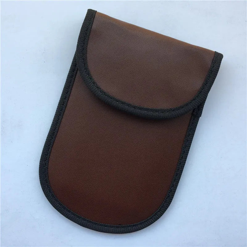 Black signal-blocking Faraday pouch for car key fobs, size 20x10 cm, lying flat on a surface