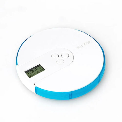 Blue 7-compartment weekly pill organiser with built-in digital alarm clock display, showing 11cm size.