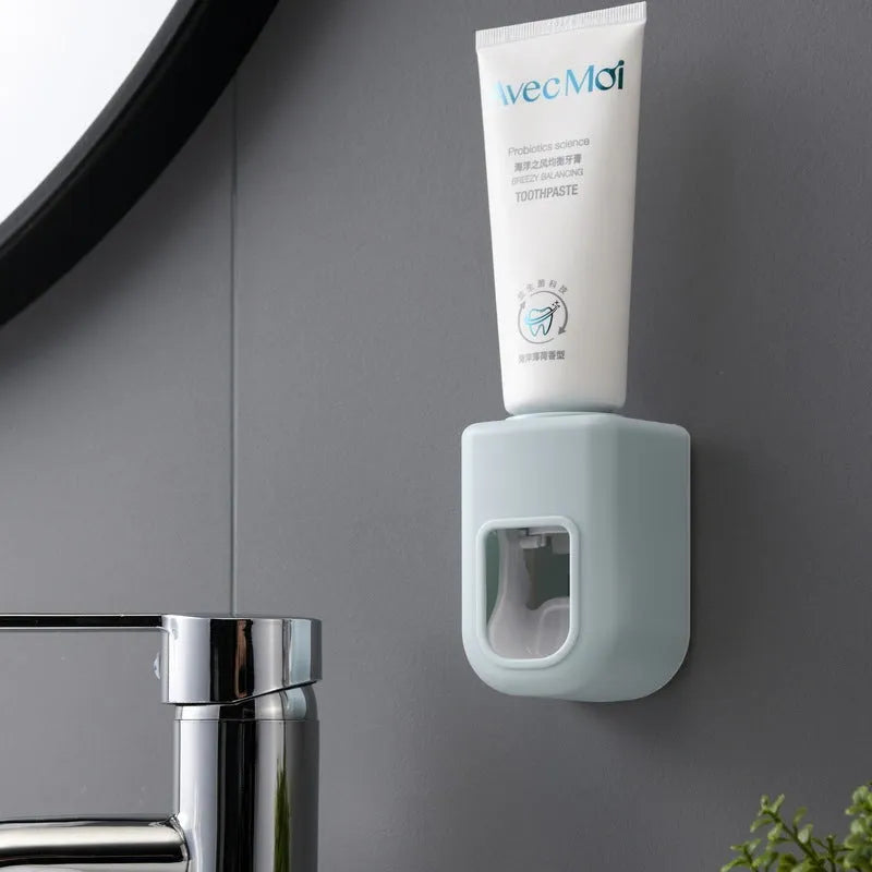 Nordic automatic toothpaste dispenser wall mounted in pink colour with compact 9x6x6cm design