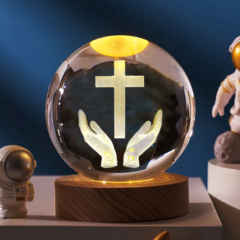 White crystal ball desk ornament on a wooden warm light base, showing purity-themed designs.