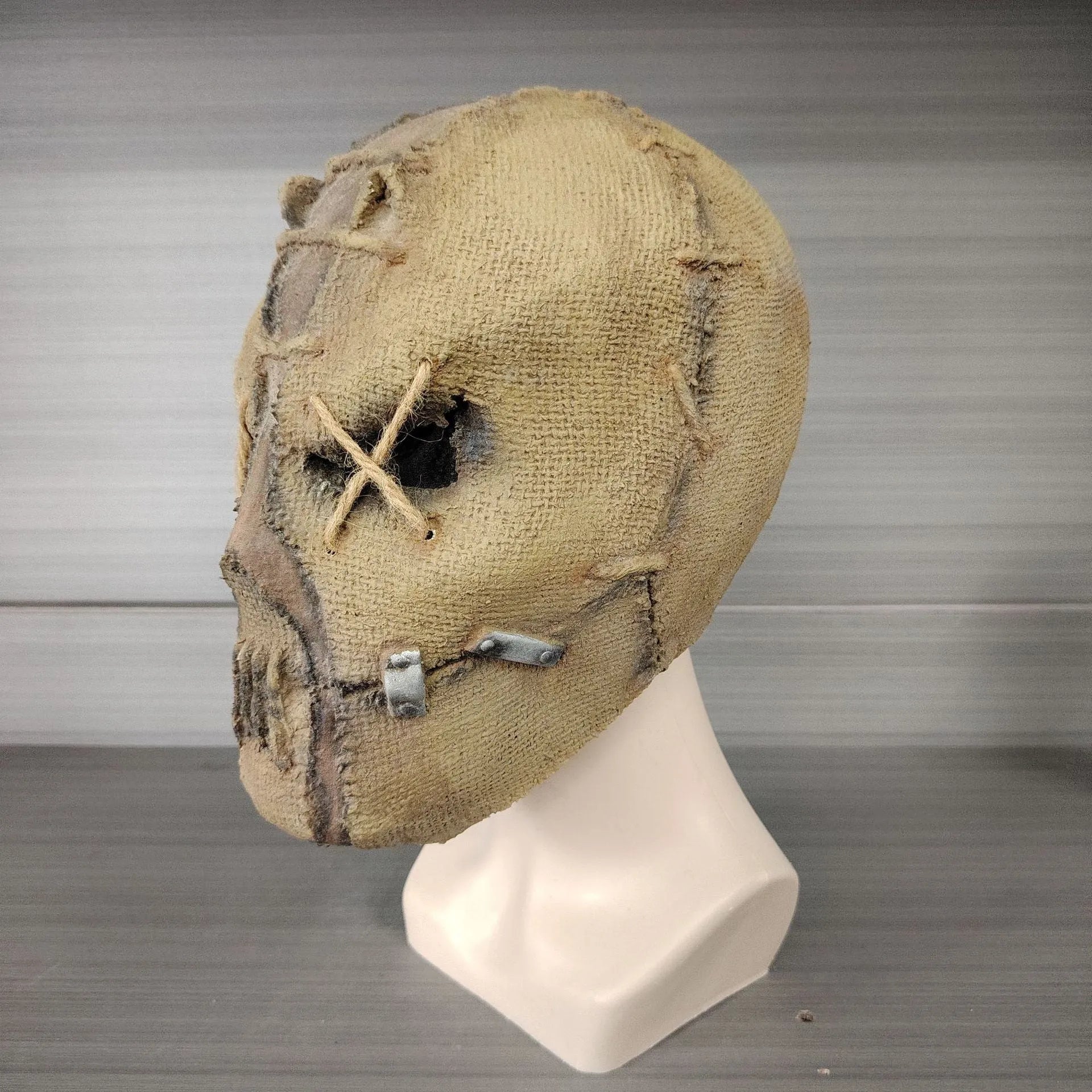 Latex Halloween horror mask showing detailed scar skull design as a full head cover.