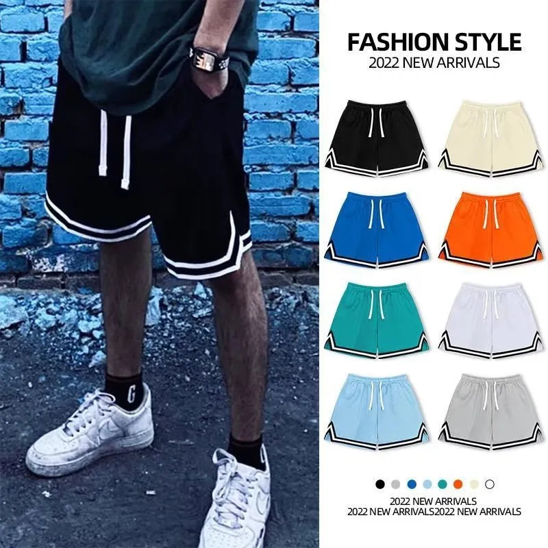 Men's loose-fit polyester sports shorts in various colours with an elastic waistband.