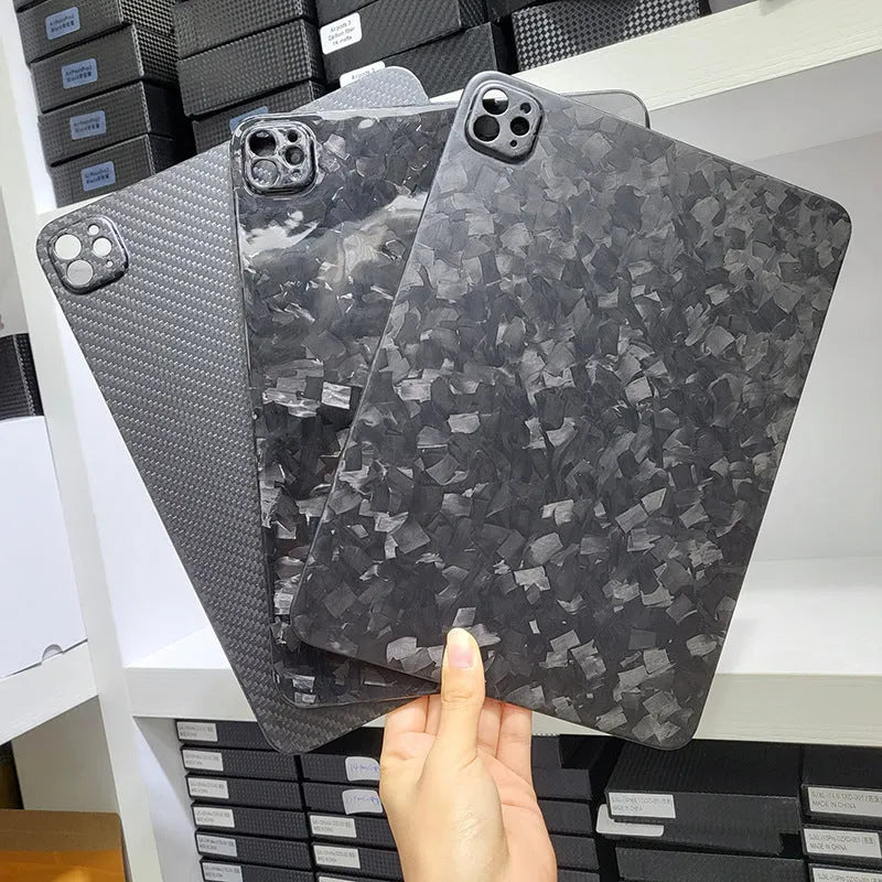 Real carbon fibre hard protective flat case for Apple iPad Pro 11 with an embossed plaid pattern.