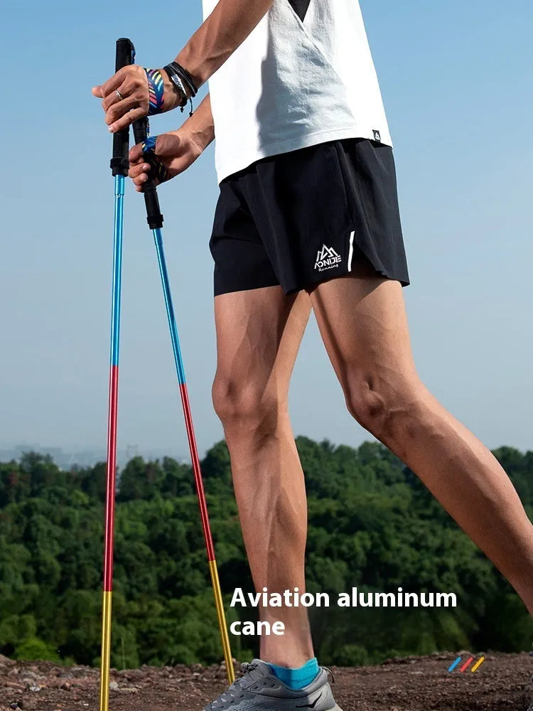 Carbon fibre folding trekking poles pair in black with adjustable length sections