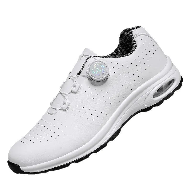 Man's black and white low-top casual tennis shoes with mesh upper and cross shoulder straps.