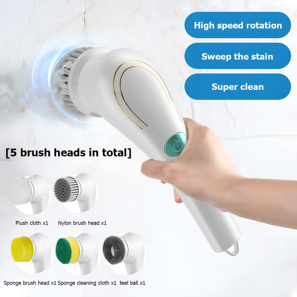 White cordless electric handheld scrubber with five attached brush heads on a table next to a USB charging cable.