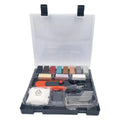 Floor repair tool with red or yellow handle and wax sticks for tile surface restoration