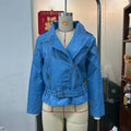 Black punk-style cropped jacket with a Peter Pan collar and a detachable waist belt on a hanger.