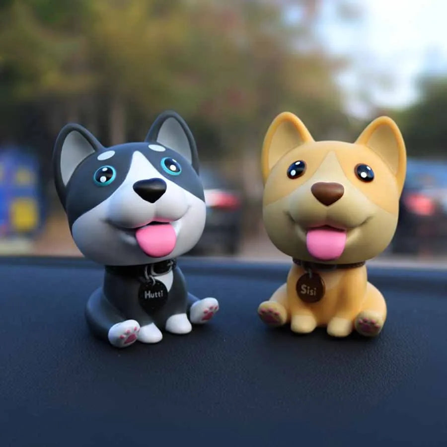PVC nodding dog bobblehead in khaki, 9.3 cm tall, on a car dashboard
