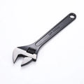 Blackened high carbon steel adjustable open-end wrench spanner showing ergonomic handle