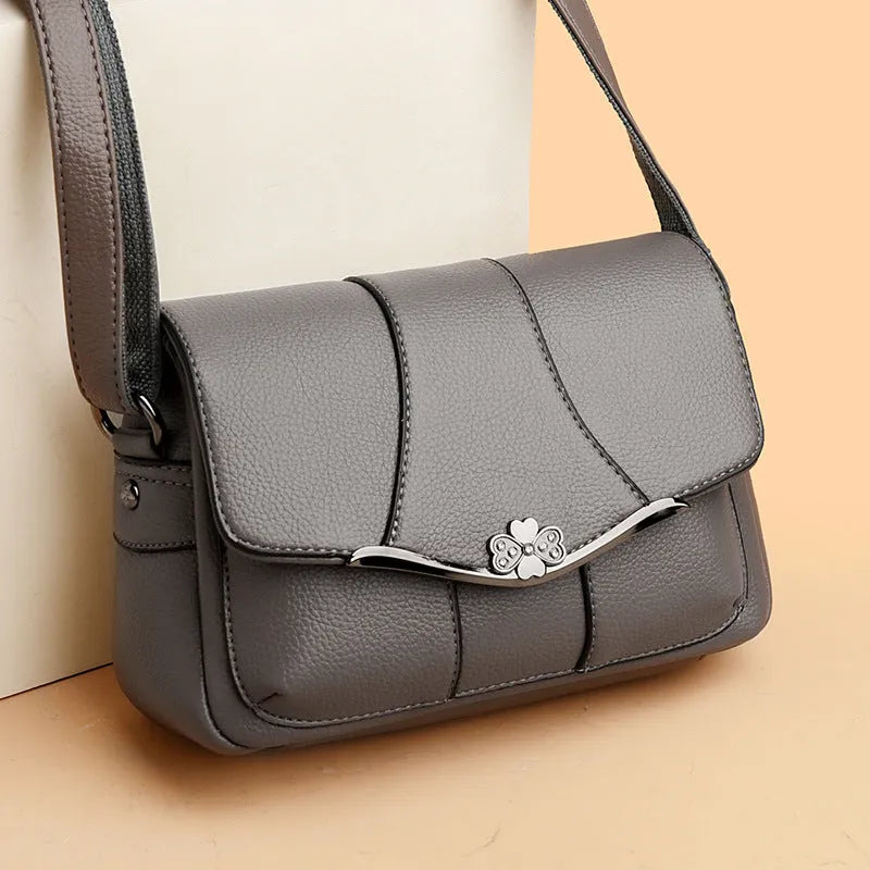 Round PU patchwork crossbody bag in beige with single shoulder strap and multiple internal pockets