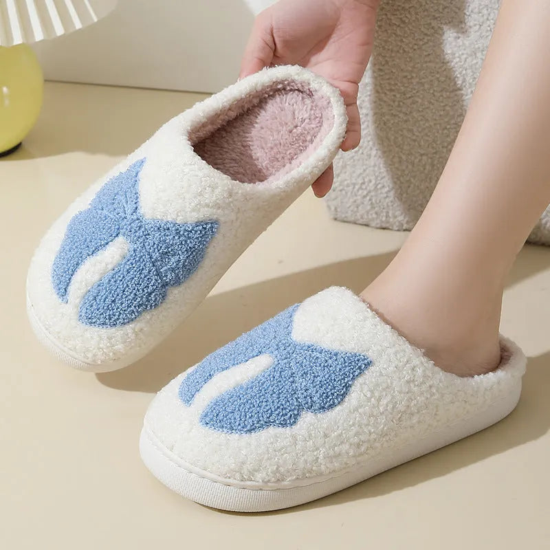 Pink and blue cartoon bow knot oversleeve slippers with suede upper and TPR sole.