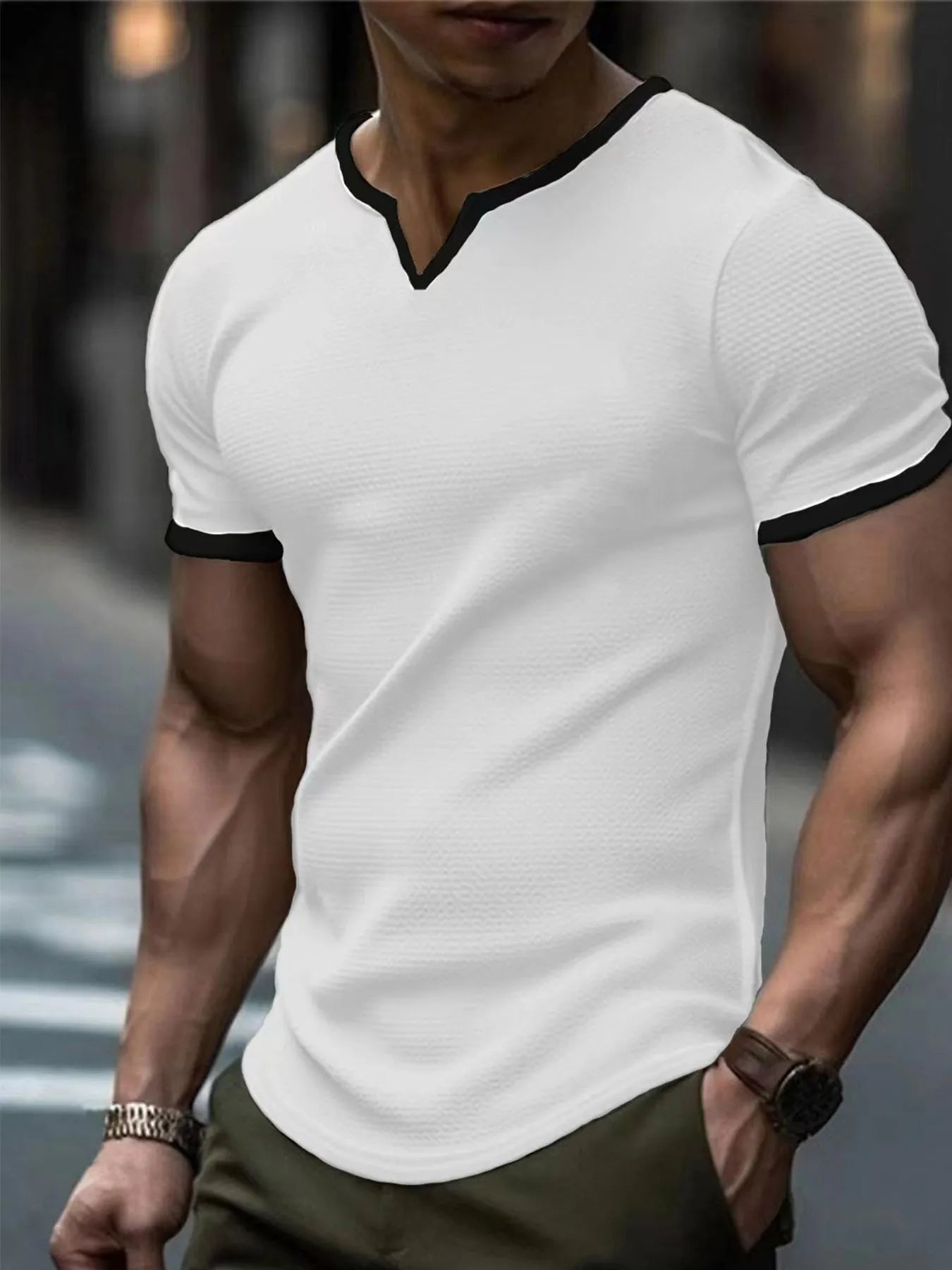 Colour-block V-neck short sleeve t-shirt in polyester waffle fabric on a neutral background.