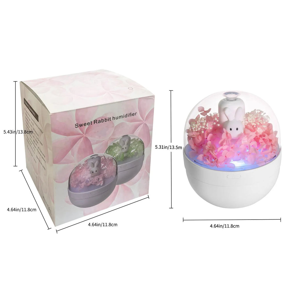 Pink ceramic rabbit vase with preserved flowers, functioning as an ultrasonic aromatherapy humidifier.