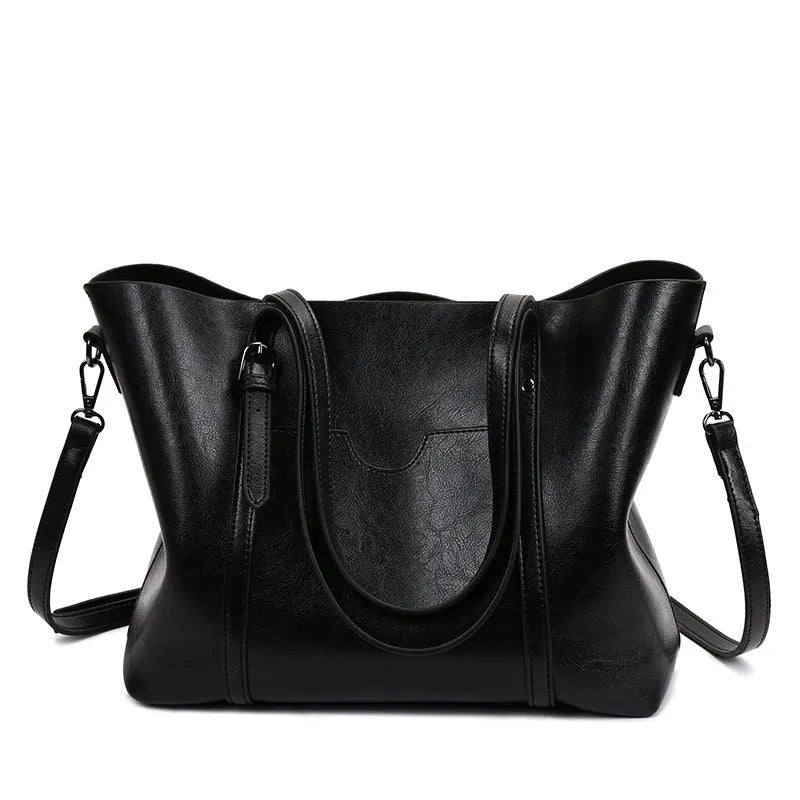 Retro-style brown PU messenger bag with top handles and a shoulder strap, shown open to reveal polyester cotton lining.