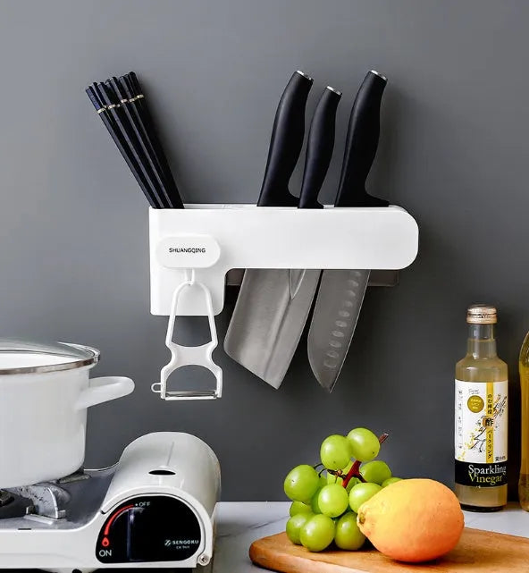 White plastic kitchen knife rack with modern simple design on countertop