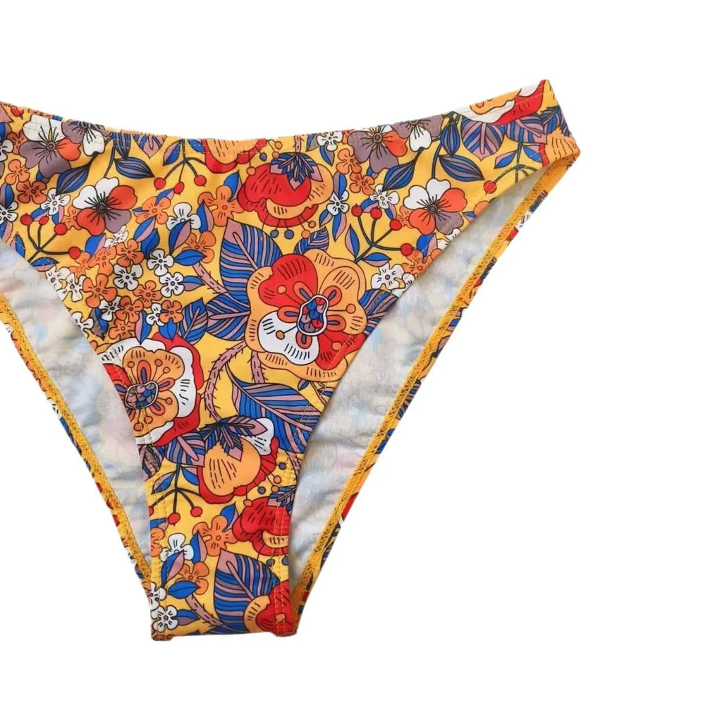 Plus size floral print strap women's bikini swimsuit with briefs style on a hanger.