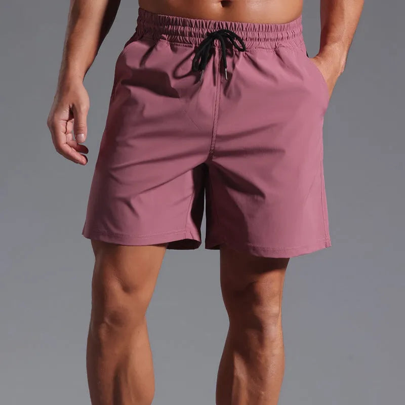 Men's loose casual shorts in quick-drying polyester fabric available in four colours
