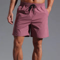 Men's loose casual shorts in quick-drying polyester fabric available in four colours