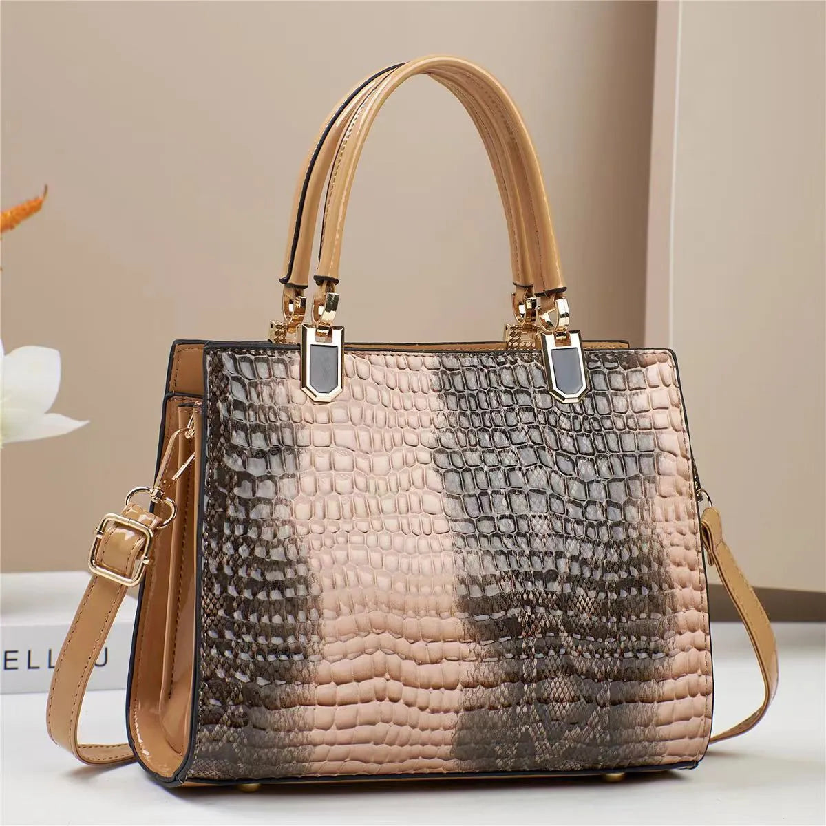 Soft PU leather one shoulder mum bag in a horizontal square shape, shown in a neutral colour with visible internal zip pockets.