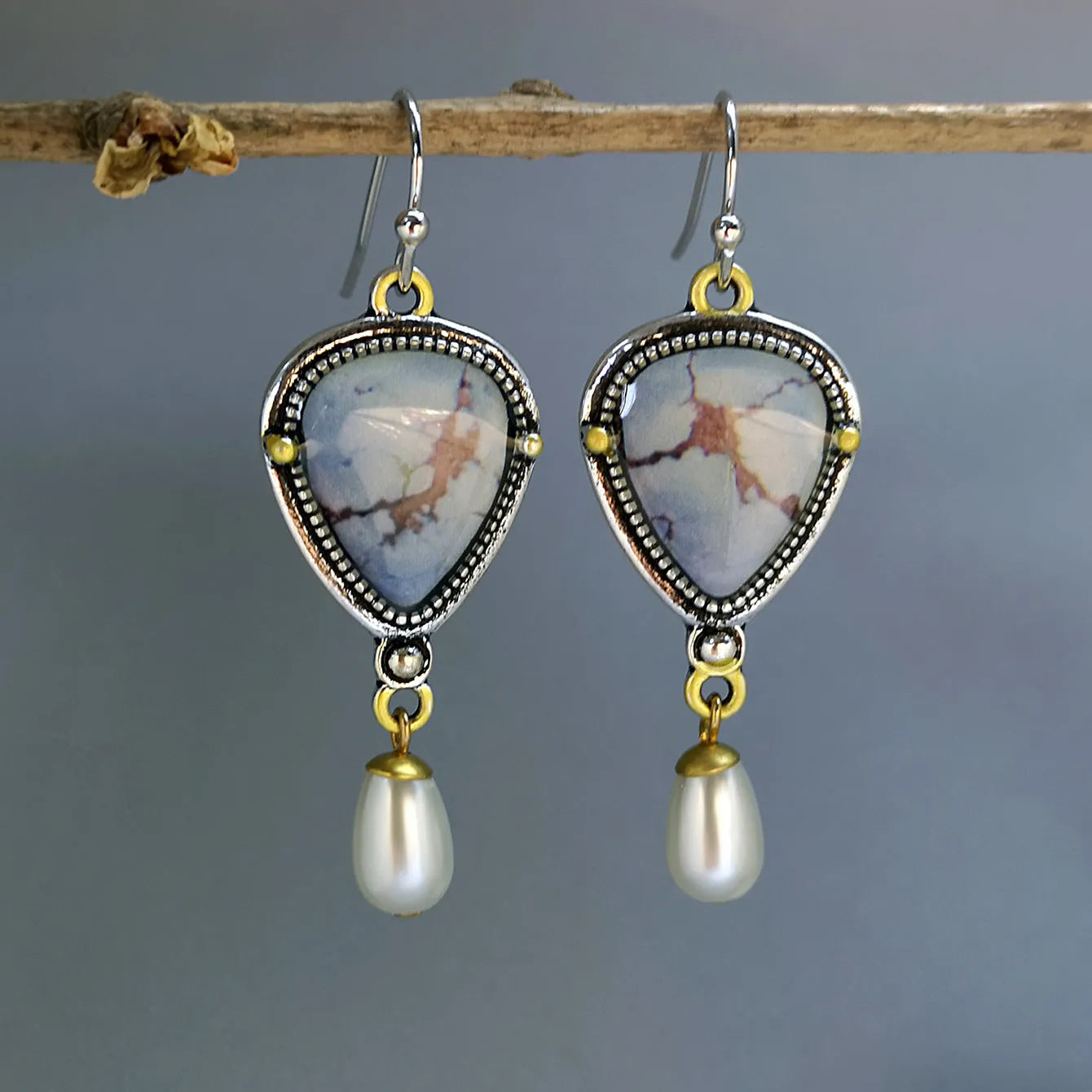 Retro blue bohemian drop earrings with synthetic opal and white pearl on metal.