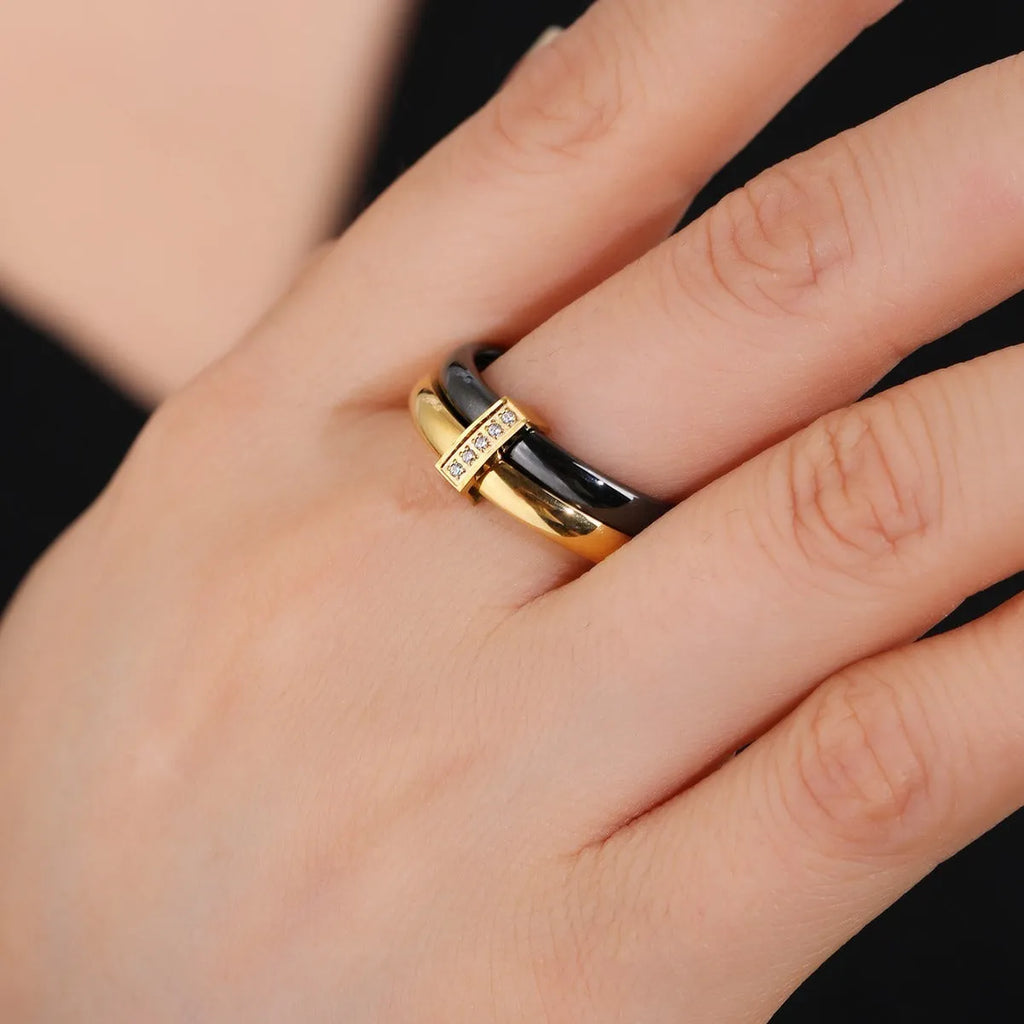 Women's titanium steel heart-shaped double ring with glossy stitching and inlaid zirconium stones.