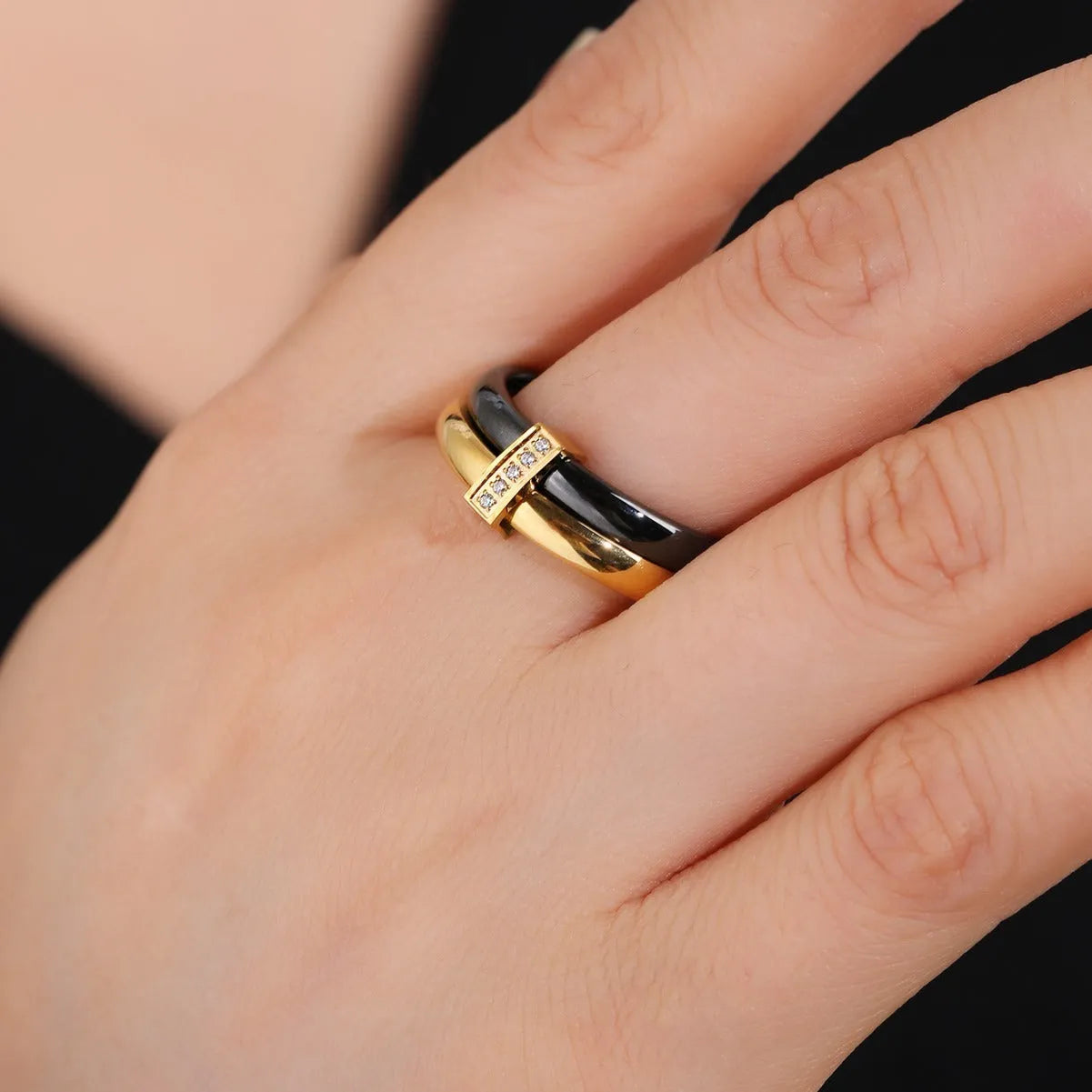 Women's titanium steel heart-shaped double ring with glossy stitching and inlaid zirconium stones.
