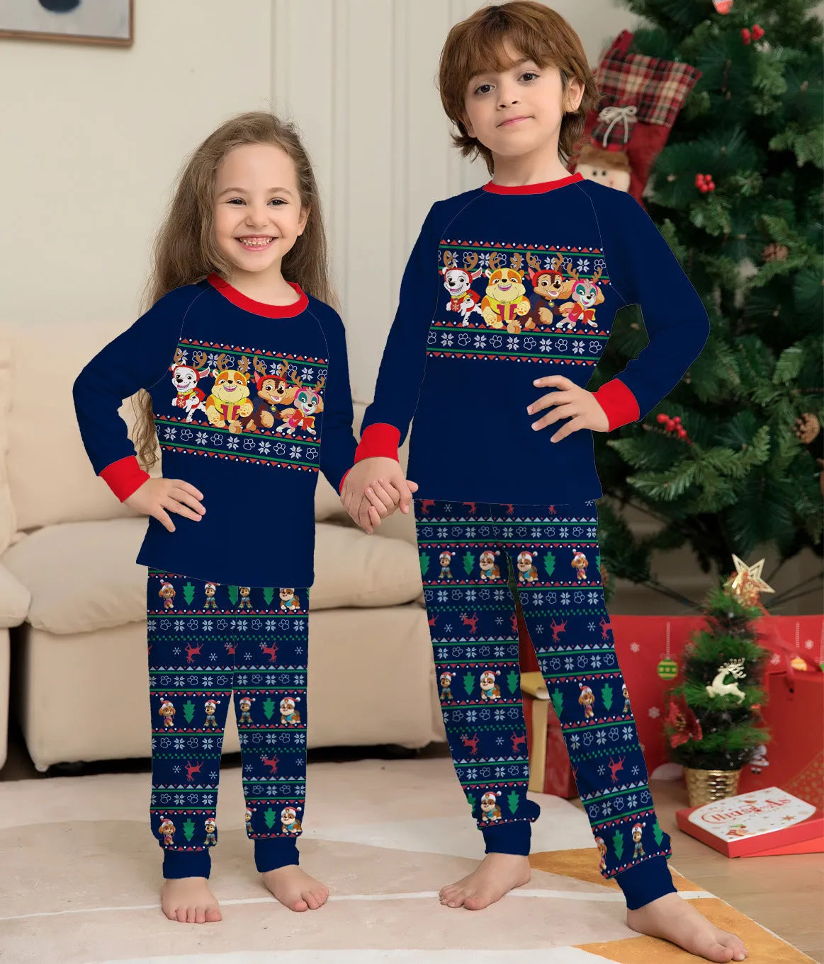 Matching red plaid Christmas pyjamas with cartoon deer print for men, women, kids, and dogs on a mannequin.